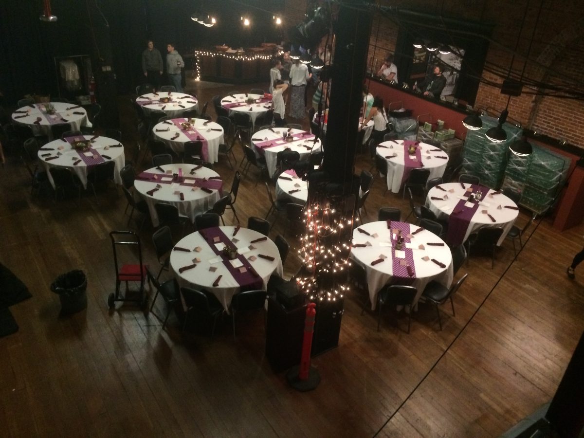 Tables are set up for a wedding reception in the SPARK Powerhouse event space in Bellingham.